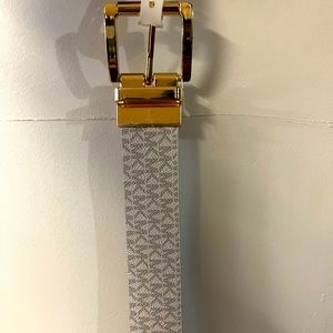 White Michael Michael Kors belts that’s reversible as well